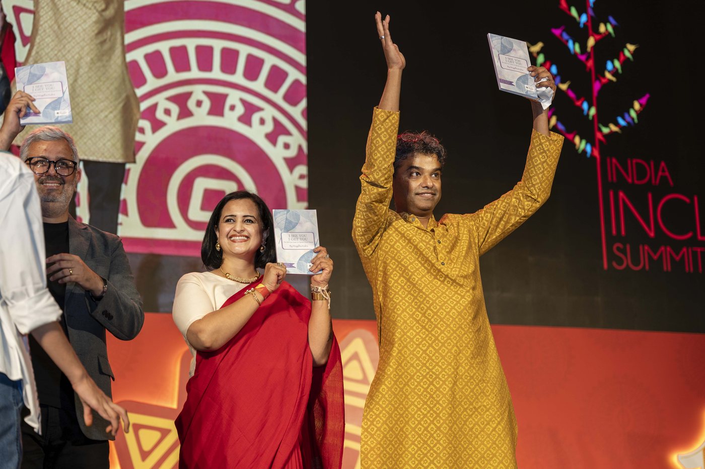 Celebrating the book launch on stage